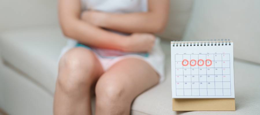 What causes a woman to menstruate twice in a month​